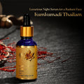 AVP Kumkumadi Thailam 10 ml blue glass dropper bottle placed on a dark surface alongside loose saffron strands, featuring the text 