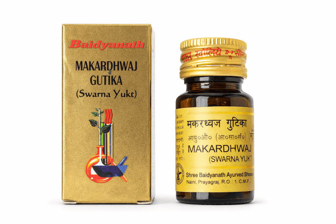 Baidyanath Makardhwaj Gutika (Swarna Yukt) 25 Tablets golden outer packaging box and matching amber glass medicine bottle with a golden cap, yellow label featuring product details in English and Hindi, and a laboratory scientific illustration | BodyStop