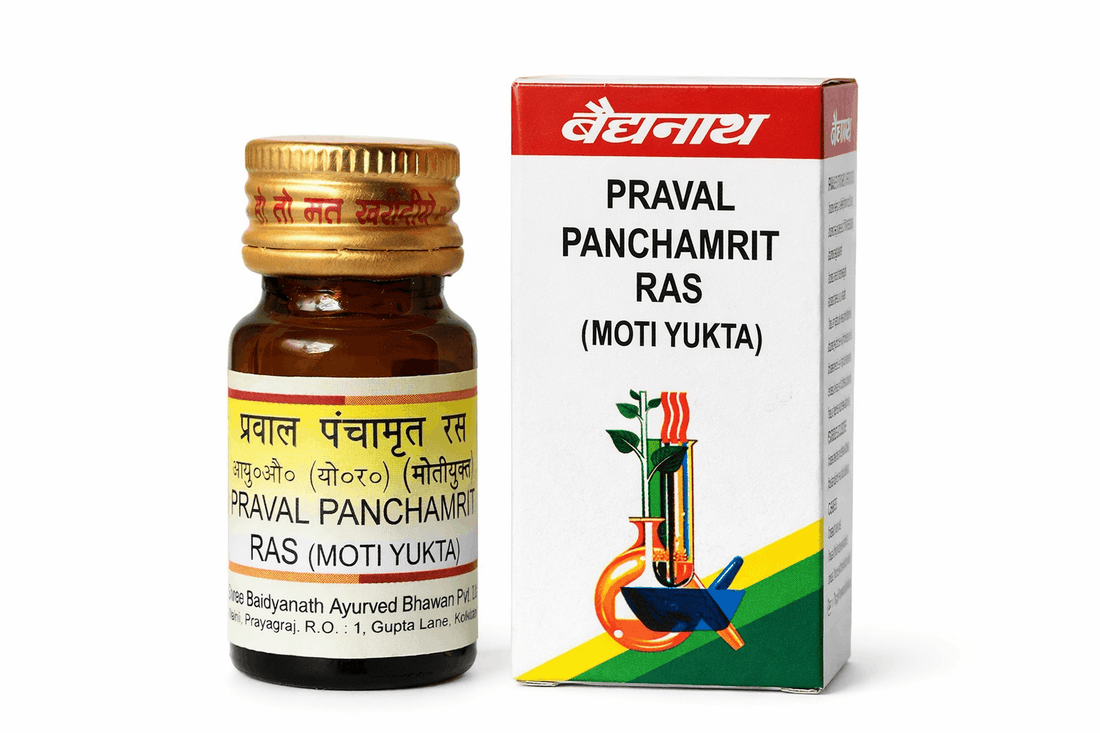 Baidyanath Praval Panchamrit Ras 10 and 25 Tablets (Moti Yukta) amber glass medicine bottle with a yellow cap next to its white and red outer packaging box featuring the Baidyanath brand logo and traditional mortar and pestle illustration | BodyStop