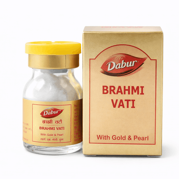 Dabur Brahmi Vati (With Gold & Pearl) 10 tablet glass medicine bottle with a yellow cap next to its gold outer packaging box featuring the Dabur brand logo | BodyStop