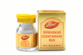 Dabur Shwaskas Chintamani Ras (With Gold & Pearl) 10 tablet glass medicine bottle with a yellow cap next to its gold outer packaging box featuring the Dabur brand logo | BodyStop
