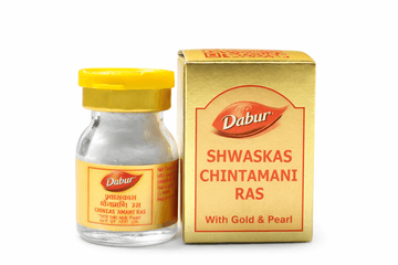 Dabur Shwaskas Chintamani Ras (With Gold & Pearl) 10 tablet glass medicine bottle with a yellow cap next to its gold outer packaging box featuring the Dabur brand logo | BodyStop