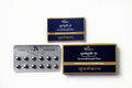 Dhootapapeshwar Suvarnabhoopati Rasa blister pack containing dark round pills alongside outer packaging boxes featuring the dark blue and gold Suvarnakalpa design | BodyStop